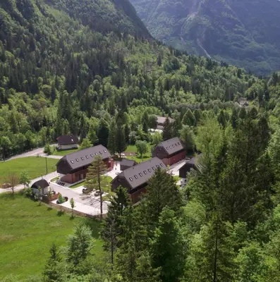 an aerial view of a resort in the mountains at Residence Soča in Soča
