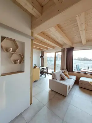 a living room with a couch and a table at BEe in foREST in Pivka