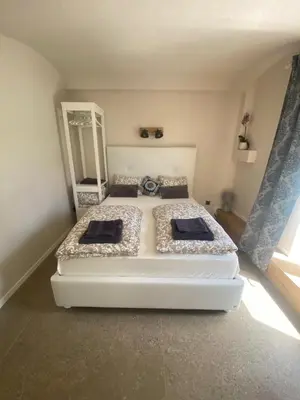 a bedroom with two beds and a mirror at NEW G&P Villa - Free Parking in Ljubljana