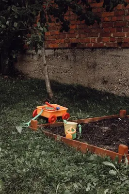 a toy train on the ground in the grass at Ecological farm Makrobios Panonija in Gornji Petrovci