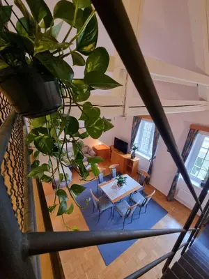 an overhead view of a living room with a table and chairs at Apartma Vrtnica, Vila Golf in Rogaška Slatina