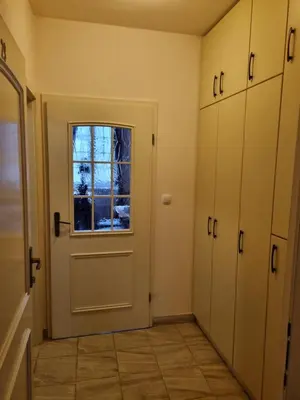 an empty room with a door and a window at Apartma Vrtnica, Vila Golf in Rogaška Slatina