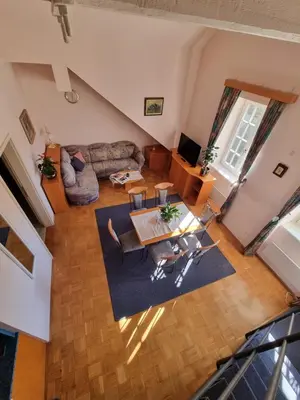 an overhead view of a living room with a table and chairs at Apartma Vrtnica, Vila Golf in Rogaška Slatina