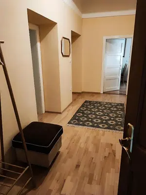 an empty room with a stair case and a door at Quiet Central in Ljubljana