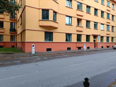 an empty street in front of a building at Quiet Central in Ljubljana
