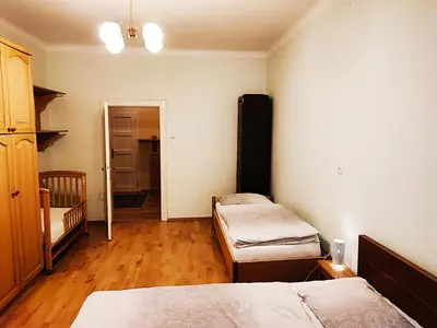 a room with two beds and a hallway at Quiet Central in Ljubljana