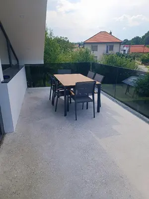 a table and chairs sitting on a patio at Apartma FRIGO in Maribor