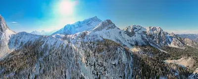 an aerial view of a mountain covered in snow at Erjavčeva mountain hut at Vršič pass in Kranjska Gora