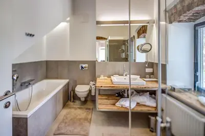 a bathroom with a tub and a sink and a toilet at Winzarei Ciringa Menhard in Zgornja Kungota
