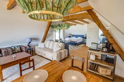 a living room with a couch and a table at Winzarei Ciringa Menhard in Zgornja Kungota