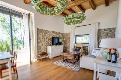 a living room with a couch and a table at Winzarei Ciringa Menhard in Zgornja Kungota