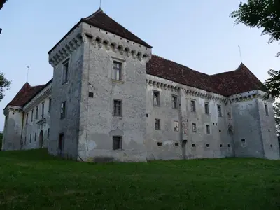 a large stone building with a red roof at House 1797 - Charm of Slovenian Vintage in Dob