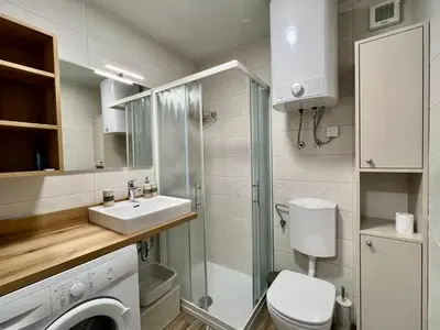 a small bathroom with a toilet and a sink at Studio Mila in Kranjska Gora