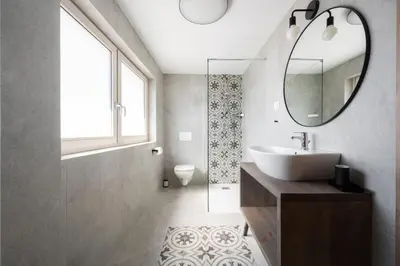 a bathroom with a sink and a mirror at GrosAlp apartments in Lesce