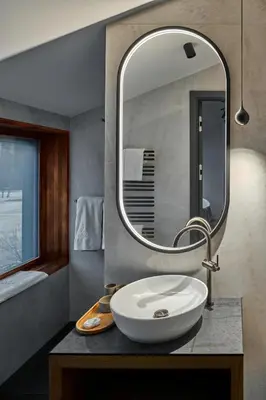 a bathroom with a sink and a mirror at Milka Boutique Hotel in Kranjska Gora