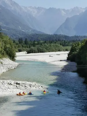 a group of people in kayaks in a river at Apartma V&T in Bovec