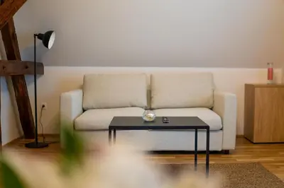 a living room with a couch and a table at Hiša Pep's in Ivanjkovci