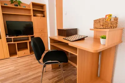 a room with a desk with a computer and a chair at DREAM BLED Balcony Apartment in Bled