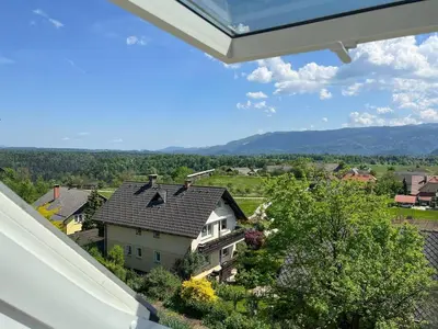 a view of a house with a roof at Alpine Retreat - Lake Bled in Bled