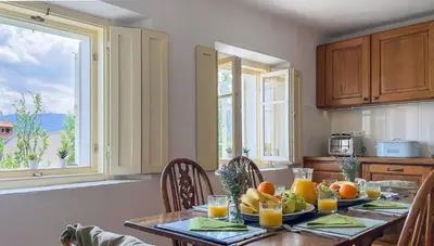 a kitchen with a table with fruit on it at Alpine Retreat - Lake Bled in Bled