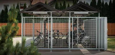 a bike parked in a gate in front of a house at Apartma Moravske Toplice 16 in Moravske Toplice