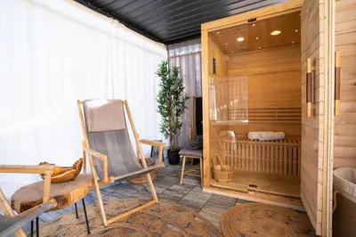 a room with a rocking chair and a crib at Glamping Happiness - Natural Pool & Wellness in Ribnica