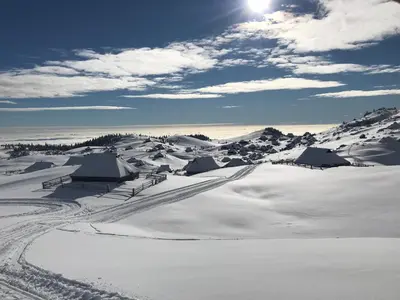 a snow covered field with tents in the snow at Apartment Activity in Radomlje