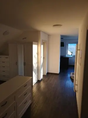 an empty room with a kitchen and a living room at Apartment with mountain view and rivers close by in Šmartno ob Dreti