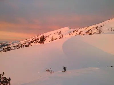 a person is skiing down a snow covered slope at Apartment with mountain view and rivers close by in Šmartno ob Dreti
