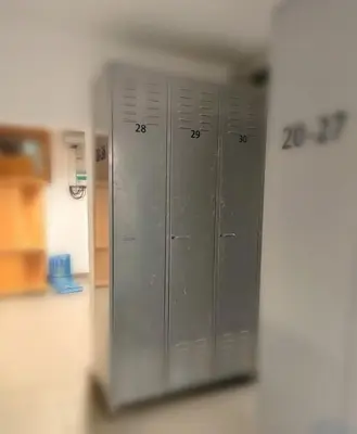 a row of gray lockers in a room at Apartma Antico in Kranjska Gora