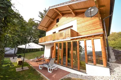 a house with glass doors and a patio at Holiday Home Liberg with Hot tub and Sauna in Brežice