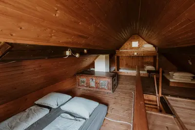 an overhead view of a bedroom in a wooden cabin at Marko's eco cabin in Bled