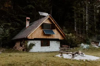 a house with a solar panel on top of it at Marko's eco cabin in Bled