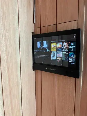 a tv is attached to a wall with a wall at Sunny Retreat Apartment in Kranjska Gora