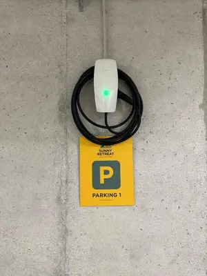 a computer mouse sitting on top of a yellow sign at Sunny Retreat Apartment in Kranjska Gora