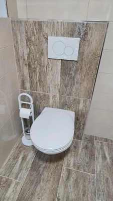 a bathroom with a white toilet in a room at Radovna Mountain Valley Cottage in Zgornje Gorje