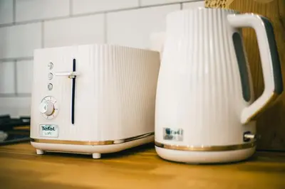 two white toasters sitting on top of a counter at BELAKAPA Authentic house with garden and free parking in Ilirska Bistrica