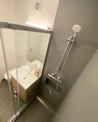 a bathroom with a shower and a sink at Apartment 3 Sovice in Bovec