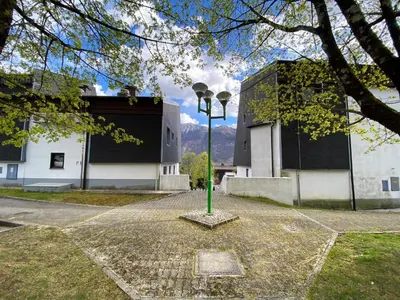 a green pole in the middle of a street at Apartment 3 Sovice in Bovec