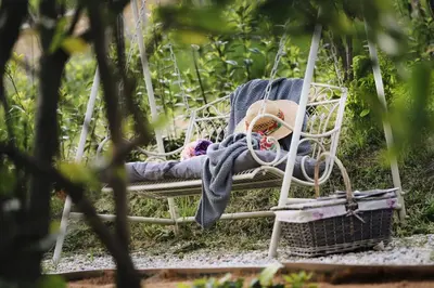 a swing with a blanket and a stuffed animal on it at Vila Vilma Vineyard Cottage in Lendava