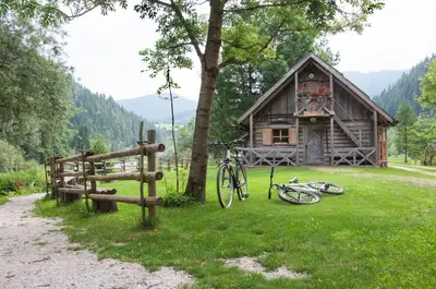 a couple of bikes parked in front of a cabin at Guesthouse S in Luče