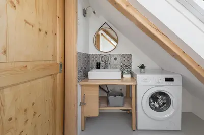 a laundry room with a washer and dryer at Captain's Lodge in Bohinj