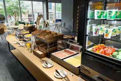 a buffet line with food in a restaurant at B&B Hotel Maribor in Maribor