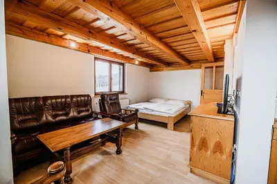 a living room with a couch and a bed at Vineyard Cottage Maleric with Pool Access in Dragatuš