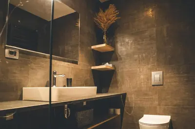 a bathroom with a sink and a toilet at Villa Vajta in Dobrovo