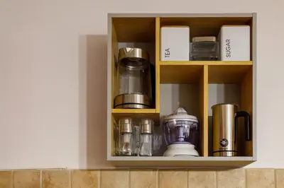 a cupboard with a bunch of items on it at Relax & Beautiful View in Slovenj Gradec