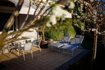 a group of chairs and a table and a table and chairs at Relax & Beautiful View in Slovenj Gradec