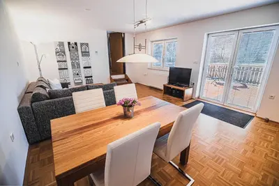 a living room with a table and a couch at Apartment pri Povhih in Slovenske Konjice