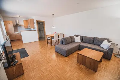 a living room with a couch and a table at Apartment pri Povhih in Slovenske Konjice