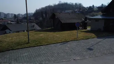 a street sign on the side of a city at Cottage Barbara with Sauna in Škofja Loka
